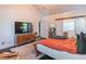 Spacious bedroom with ensuite bathroom, wooden floors, and vaulted ceilings at 2405 Hillside Ave, Decatur, GA 30032