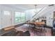 Open-concept dining area connects the living room and stairs, and has a beverage fridge at 2405 Hillside Ave, Decatur, GA 30032