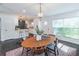Dining room is sunlit and adjacent to the kitchen in an open concept layout at 2405 Hillside Ave, Decatur, GA 30032