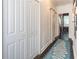 Hallway featuring hardwood floors, sliding doors and a quirky carpet runner at 2405 Hillside Ave, Decatur, GA 30032