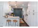 Well-appointed kitchen offers stainless appliances, white cabinets, and breakfast bar seating at 2405 Hillside Ave, Decatur, GA 30032