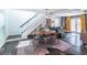 Open-concept living/dining area features hardwood floors, stylish decor, and lots of natural light at 2405 Hillside Ave, Decatur, GA 30032