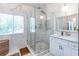 Luxurious main bathroom featuring a glass shower, marble tile and a modern vanity at 2405 Hillside Ave, Decatur, GA 30032