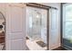 Gorgeous main bathroom with glass enclosed shower and sliding barn door at 2405 Hillside Ave, Decatur, GA 30032