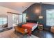 Comfortable main bedroom with a unique wall design and sliding door access to the main bathroom at 2405 Hillside Ave, Decatur, GA 30032