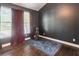 Cozy office featuring dark gray walls, hardwood floors, and golf clubs at 2405 Hillside Ave, Decatur, GA 30032