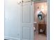 Charming powder room featuring a sliding door and a unique vessel sink at 2405 Hillside Ave, Decatur, GA 30032
