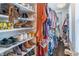 Organized walk-in closet with shelves and hanging rods for optimal storage at 2405 Hillside Ave, Decatur, GA 30032