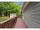 Wood back deck with stairs overlooking the backyard, shed, and trees at 3919 Valley Brook Rd, Snellville, GA 30039