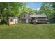A fully fenced backyard features green lawn, a deck, and a storage shed at 3919 Valley Brook Rd, Snellville, GA 30039
