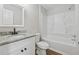 Updated bathroom features a granite vanity top, modern fixtures, and a tub-shower combo at 3919 Valley Brook Rd, Snellville, GA 30039