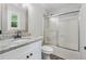 Modern bathroom featuring a granite vanity top, modern fixtures, and a shower-tub combo at 3919 Valley Brook Rd, Snellville, GA 30039