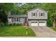 Charming two-story home with a well-manicured lawn and a two-car garage at 3919 Valley Brook Rd, Snellville, GA 30039