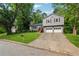 Charming split-level home with lush greenery and a long driveway at 3919 Valley Brook Rd, Snellville, GA 30039