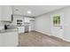 Modern kitchen with stainless appliances, granite countertops, and backyard access at 3919 Valley Brook Rd, Snellville, GA 30039