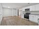 Modern kitchen features stainless steel appliances, white cabinetry, and granite countertops at 3919 Valley Brook Rd, Snellville, GA 30039