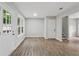 Bright living room featuring hardwood flooring and access to the backyard at 3919 Valley Brook Rd, Snellville, GA 30039