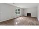 Bright living room with wood-look flooring and fireplace at 3919 Valley Brook Rd, Snellville, GA 30039