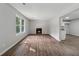 Bright living room with fireplace and wood-look flooring at 3919 Valley Brook Rd, Snellville, GA 30039