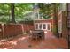 Outdoor patio space with brick pavers and a table, perfect for entertaining guests at 8643 Ellard Dr, Alpharetta, GA 30022