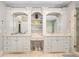 Bright bathroom featuring double vanity sinks, stone countertops, and large mirrors at 8643 Ellard Dr, Alpharetta, GA 30022