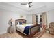 Comfortable bedroom with ample natural light, ceiling fan, and stylish decor at 8643 Ellard Dr, Alpharetta, GA 30022