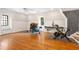 Spacious bonus room features hardwood floors, large windows and ample space for a home gym at 8643 Ellard Dr, Alpharetta, GA 30022