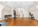 Spacious bonus room featuring hardwood floors and neutral paint. Versatile living space at 8643 Ellard Dr, Alpharetta, GA 30022