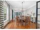 Inviting dining area with hardwood floors, chandelier, and open access to living spaces, perfect for entertaining guests at 8643 Ellard Dr, Alpharetta, GA 30022