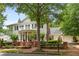 Beautiful two-story home with white exterior, brick accents, and manicured front yard at 8643 Ellard Dr, Alpharetta, GA 30022