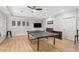 Spacious game room with a ceiling fan, ping pong table, and ample lighting at 8643 Ellard Dr, Alpharetta, GA 30022