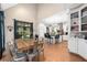 Open concept kitchen with stainless steel appliances, a center island with seating, and an adjacent dining area at 8643 Ellard Dr, Alpharetta, GA 30022