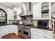 A gourmet kitchen with stainless steel appliances, custom cabinets, and sleek countertops at 8643 Ellard Dr, Alpharetta, GA 30022