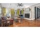 Bright living room with hardwood floors, fireplace, and an open floor plan at 8643 Ellard Dr, Alpharetta, GA 30022