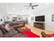Inviting basement den with a large sectional sofa and convenient kitchenette at 8643 Ellard Dr, Alpharetta, GA 30022