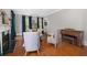 Chic living room offers hardwood floors, a fireplace, and plenty of natural light with refined furniture and decor at 8643 Ellard Dr, Alpharetta, GA 30022