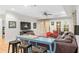 Cozy living room with comfortable seating, large TV, and French doors leading to the outdoors at 8643 Ellard Dr, Alpharetta, GA 30022