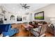Inviting living room with a fireplace, built-in cabinets, and plenty of seating at 8643 Ellard Dr, Alpharetta, GA 30022
