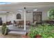 A covered patio with outdoor seating, a ceiling fan, and a grill at 8643 Ellard Dr, Alpharetta, GA 30022