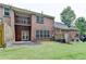 Backyard featuring nice lawn, brick building, a patio and a deck at 1102 Lexington Dr, Roswell, GA 30075