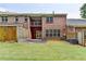 Backyard featuring nice lawn, brick building, a patio and a deck at 1102 Lexington Dr, Roswell, GA 30075