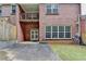Backyard featuring nice lawn, brick building, a patio and a deck at 1102 Lexington Dr, Roswell, GA 30075