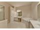 Bathroom featuring a soaking tub, double sink vanity, and tile flooring at 1102 Lexington Dr, Roswell, GA 30075