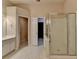 Bathroom with a glass shower, double sink vanity, and access to a closet at 1102 Lexington Dr, Roswell, GA 30075