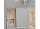 The bedroom has neutral carpet and paint, featuring an ensuite bathroom and access to the hallway at 1102 Lexington Dr, Roswell, GA 30075