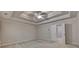 Bedroom featuring a tray ceiling, a ceiling fan, and natural light at 1102 Lexington Dr, Roswell, GA 30075