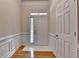 Bright entryway featuring hardwood floors, white trim, and natural light at 1102 Lexington Dr, Roswell, GA 30075