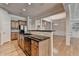 Modern kitchen showcasing a large island, stainless appliances, granite countertops and an open design at 1102 Lexington Dr, Roswell, GA 30075