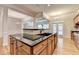 Well-appointed kitchen with granite countertops, stainless steel appliances, island with sink, and bar seating at 1102 Lexington Dr, Roswell, GA 30075