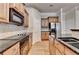 Kitchen with stainless appliances, granite countertops, a breakfast bar and an open floorplan at 1102 Lexington Dr, Roswell, GA 30075
